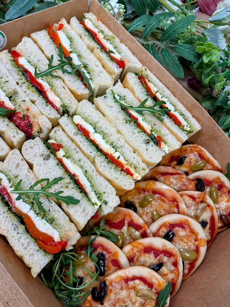 Boxes of sandwiches, wraps and fruit tartlets