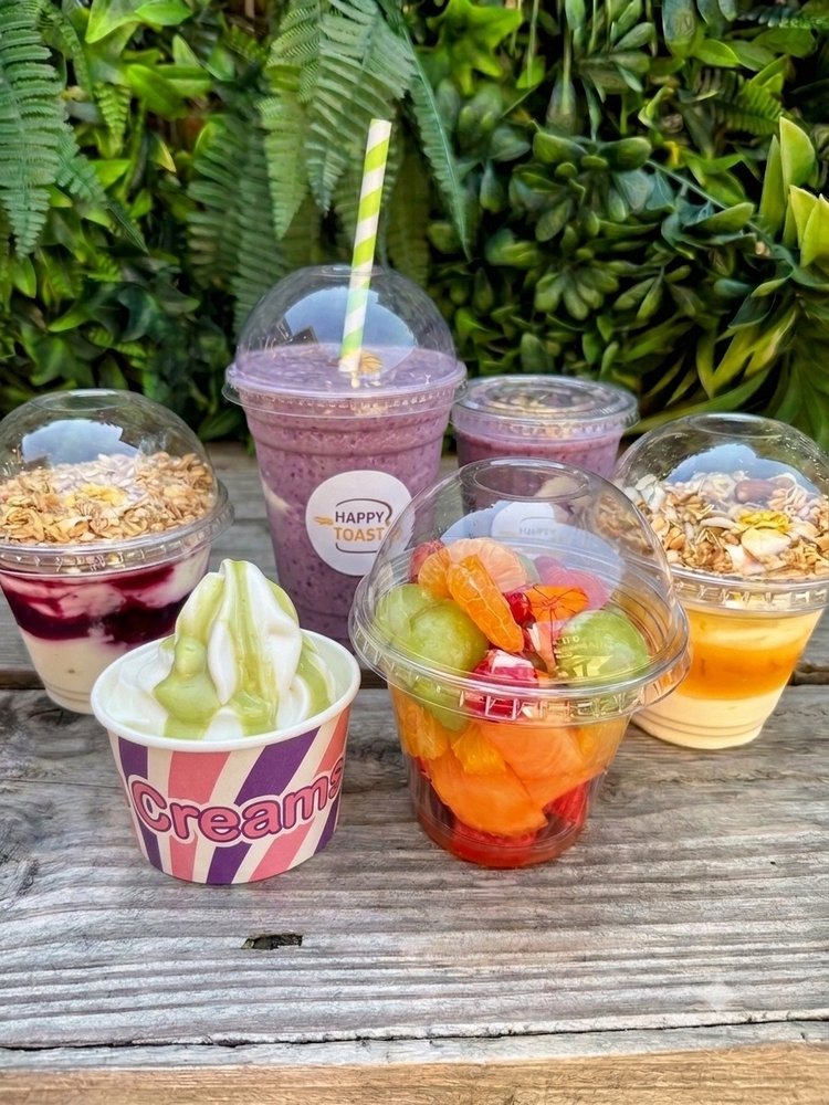 Berry smoothies, granola and yogurt parfaits, a fresh fruit cup and an ice cream tub