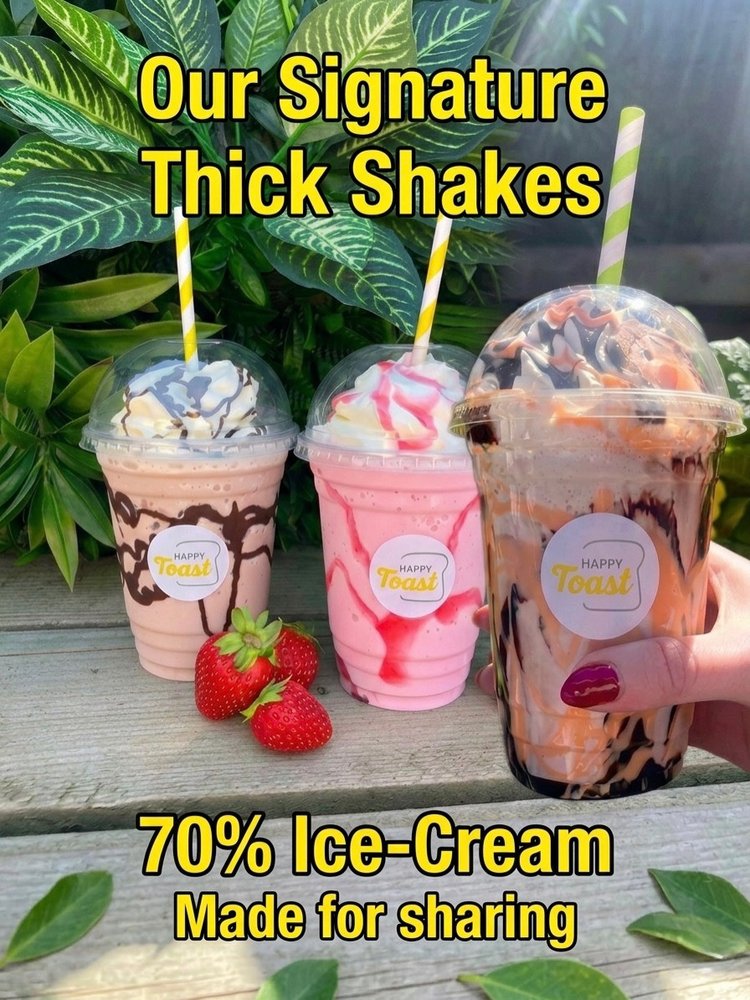 Three thick shakes topped with cream and sauce &mdash; chocolate, strawberry and salted caramel