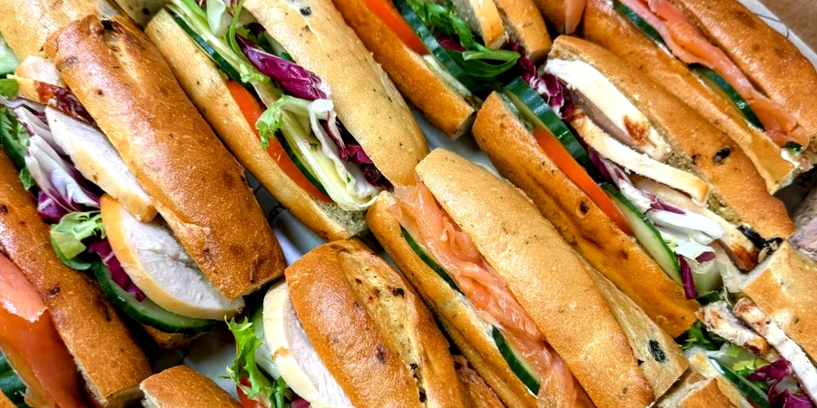 Filled baguettes with chicken, smoked salmon and salad